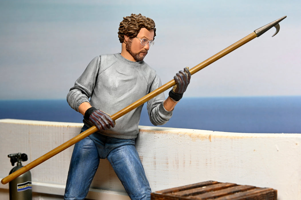 NECA Figura de Accion Ultimate: Jaws 50 Aniversario - Matt Hooper Amity Arrival 7 Pulgadas