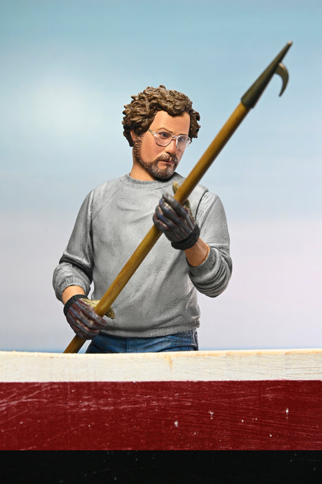 NECA Figura de Accion Ultimate: Jaws 50 Aniversario - Matt Hooper Amity Arrival 7 Pulgadas