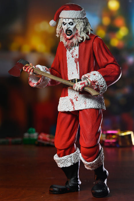 NECA Figura de Accion Ultimate: Terrifier 3 - Santa Suit Art the Clown Bloody Version 7 Pulgadas