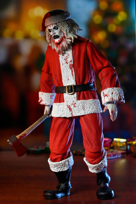 NECA Figura de Accion Ultimate: Terrifier 3 - Santa Suit Art the Clown Bloody Version 7 Pulgadas