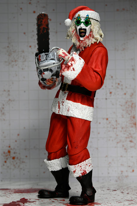 NECA Figura de Accion Ultimate: Terrifier 3 - Santa Suit Art the Clown Bloody Version 7 Pulgadas