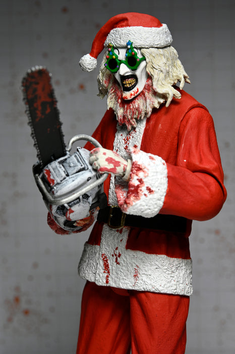 NECA Figura de Accion Ultimate: Terrifier 3 - Santa Suit Art the Clown Bloody Version 7 Pulgadas