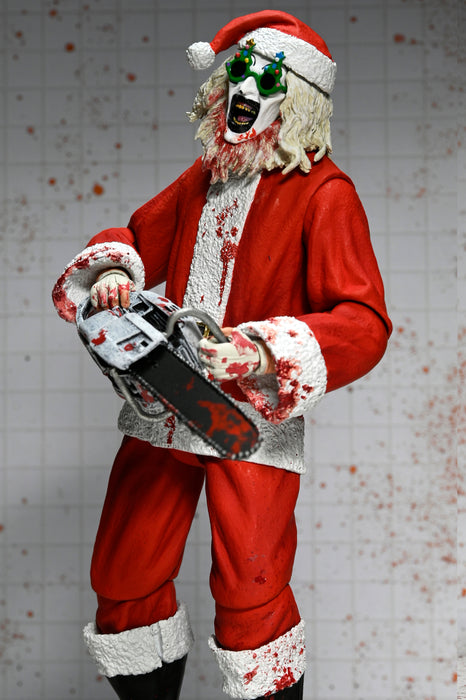 NECA Figura de Accion Ultimate: Terrifier 3 - Santa Suit Art the Clown Bloody Version 7 Pulgadas