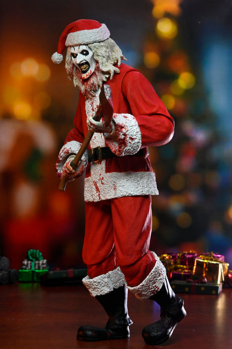 NECA Figura de Accion Ultimate: Terrifier 3 - Santa Suit Art the Clown Bloody Version 7 Pulgadas