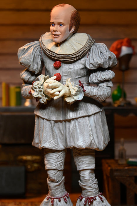 NECA Figura de Accion Ultimate: Welcome to Derry - Bob Gray como Pennywise 7 Pulgadas