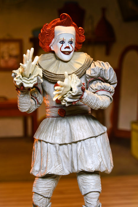 NECA Figura de Accion Ultimate: Welcome to Derry - Bob Gray como Pennywise 7 Pulgadas
