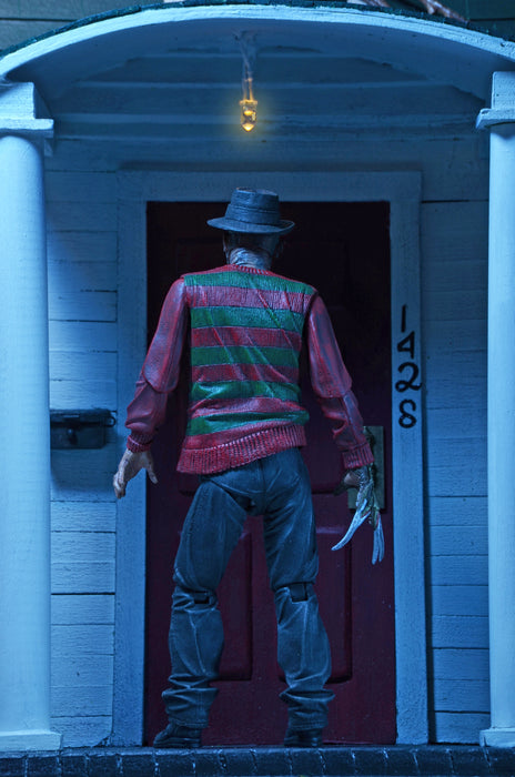 NECA Figura de Accion Ultimate: Pesadilla En La Calle Del Infierno 30 Aniversario - Freddy 7 Pulgadas